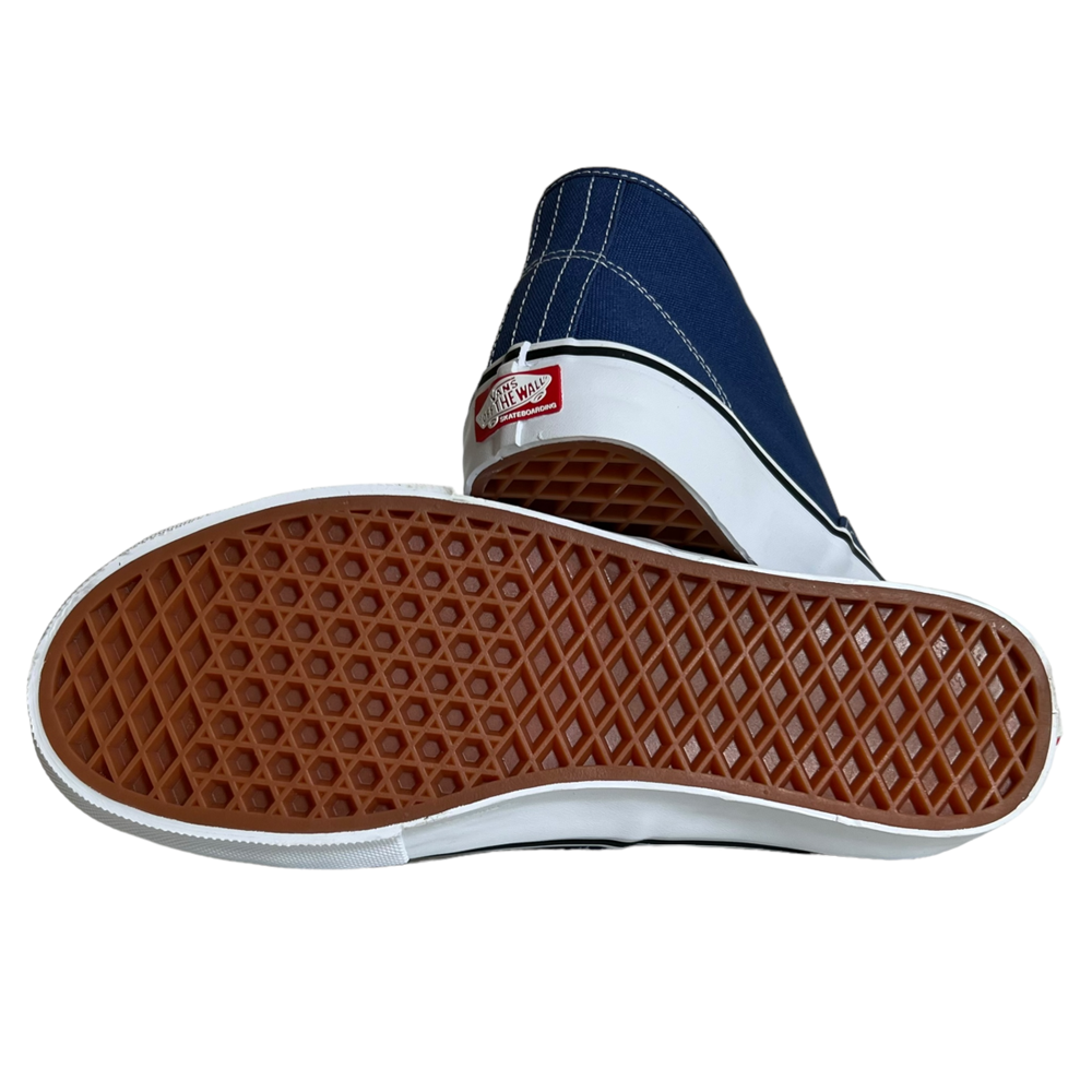 A pair of VN0007PHO2Y Steve Navy Authentic Mid Vans Skate Canvas Shoes with white soles—one shoe on its side showing the brown waffle-patterned sole and PopCush cushioning, the other upright with the Off the Wall logo on the heel.