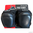 Two 187 Pro Knee Pads Black, size XL, with hard protective caps are attached to a display card labeled "Pro Knee." The packaging features a skateboarder graphic and highlights this high-quality protective gear.