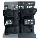 A pack of 187 Wrist Guard Black offers superior wrist protection, displayed on a branded backing card with cartoon skaters and "WRIST GUARDS" at the top.