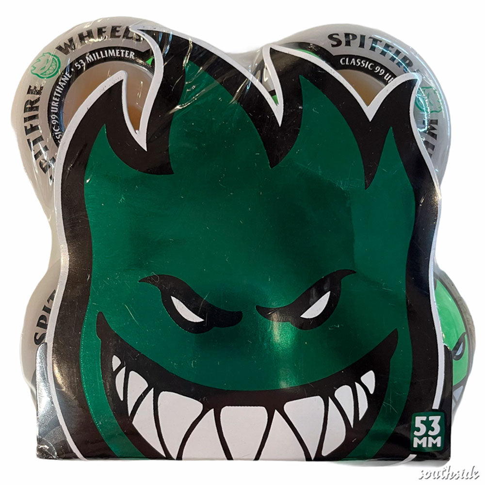 A set of Spitfire Wheels Bighead 53mm99A in white, featuring the iconic green Bighead face with sharp teeth and angry eyes, packaged together with a label reading SPITFIRE WHEELS.