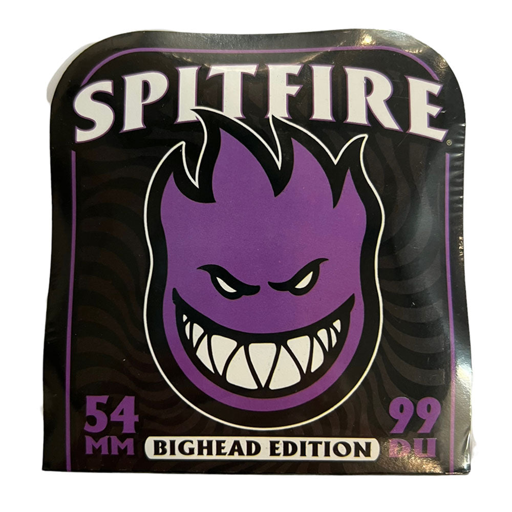 A sticker with "SPITFIRE" above a large, purple, cartoon flame Bighead face grinning wide. Bottom text reads: Spitfire Wheels Bighead 54mm99A.