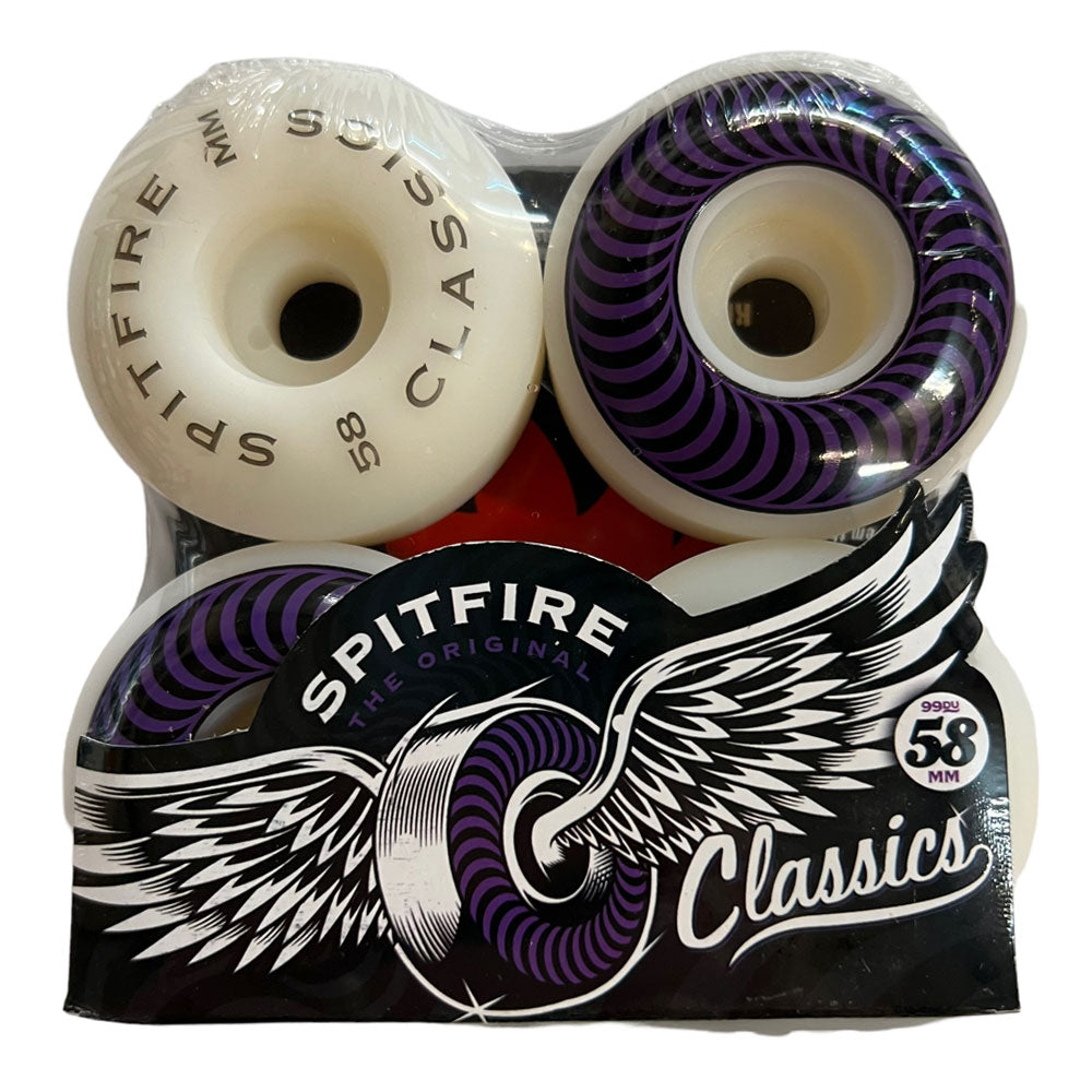 Four Spitfire Wheels Classics 58mm99A are packaged together. The packaging features the Spitfire logo, and two wheels display purple swirl graphics with a winged wheel design.