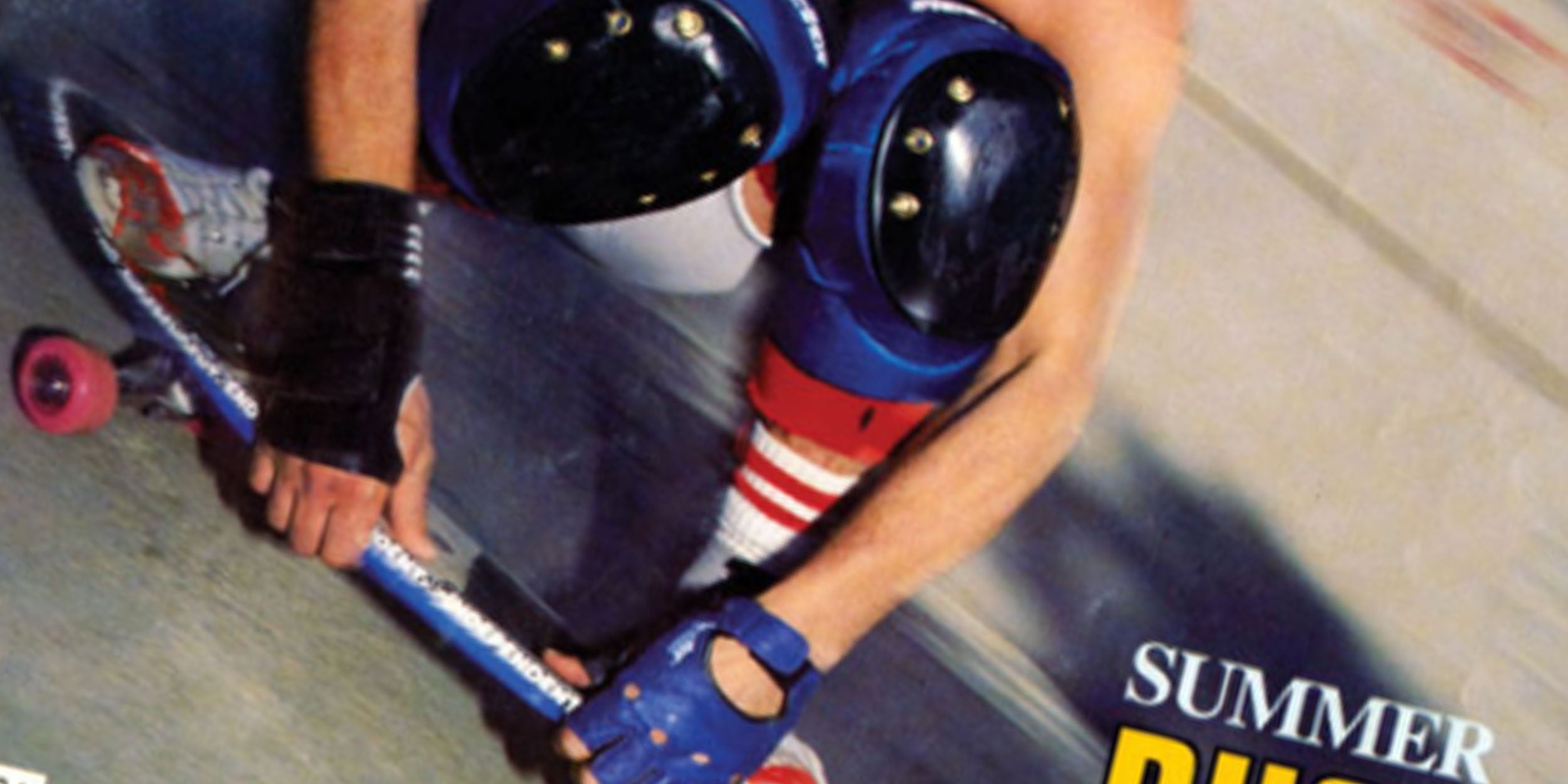 A skateboarder wearing a helmet, knee pads, gloves, and striped socks leans sharply while turning on a ramp. The words Summer and Push are partially visible in the bottom right corner.