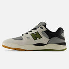 The 1010 B Tiago Lemos Sea Slate Dark Olivine New Balance Numeric Suede Skateboarding Shoe features a white, gray, black, and green colorway with mesh panels, a gum sole, and a bold “N” logo on the side. Viewed from the left, this pro-endorsed model is inspired by skateboarding legend Tiago Lemos.