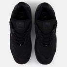 A pair of 1010 CR Tiago Lemos Black New Balance Numeric Suede Skateboarding Shoes seen from above, featuring laces, TIAGO branding on the tongues, and a durable ABZORB midsole for comfort.