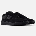 The 1010 CR Tiago Lemos Black New Balance Numeric Suede Skateboarding Shoes feature suede and mesh panels, the signature N logo, black laces, an ABZORB midsole, and a durable black rubber sole—ideal for stylish skating on a light gray background.