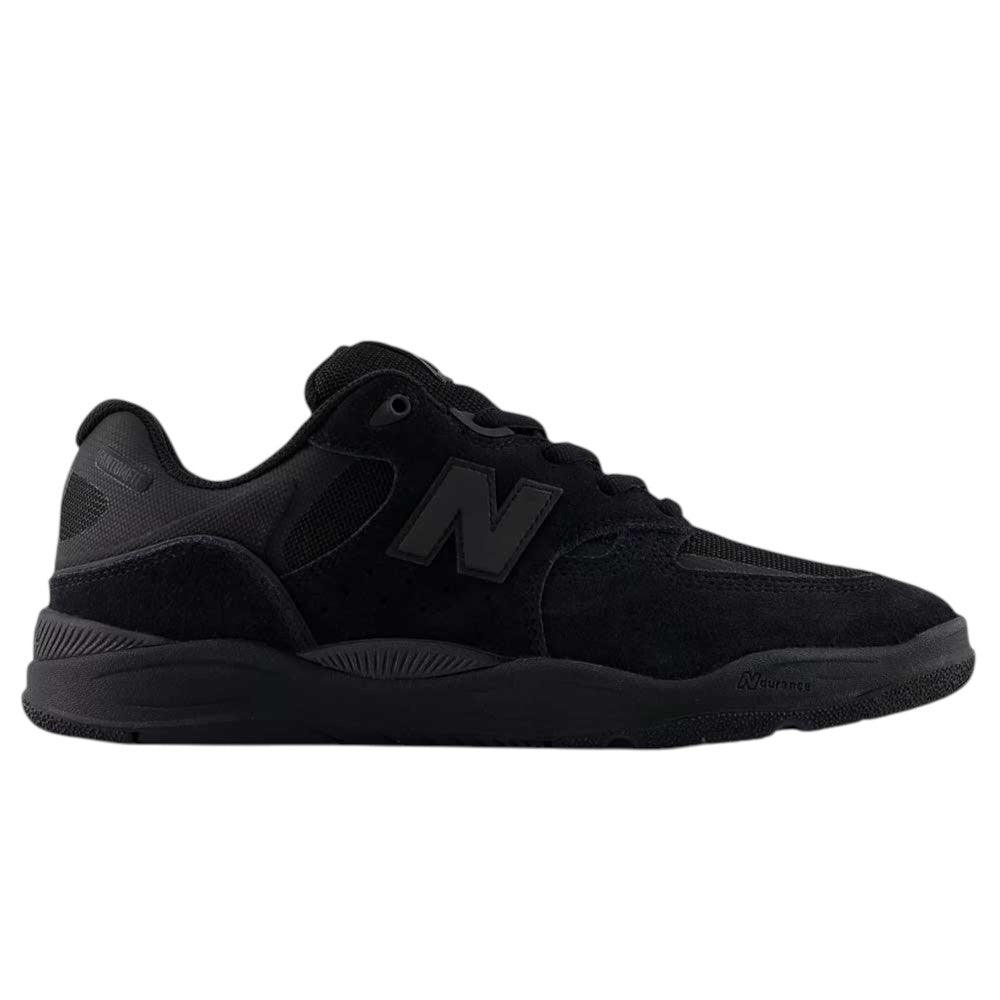 A side view of the 1010 CR Tiago Lemos Black New Balance Numeric Suede Skateboarding Shoes, showcasing a durable black mesh and suede upper, a thick rubber sole with ABZORB midsole cushioning, and the iconic N logo on the side.