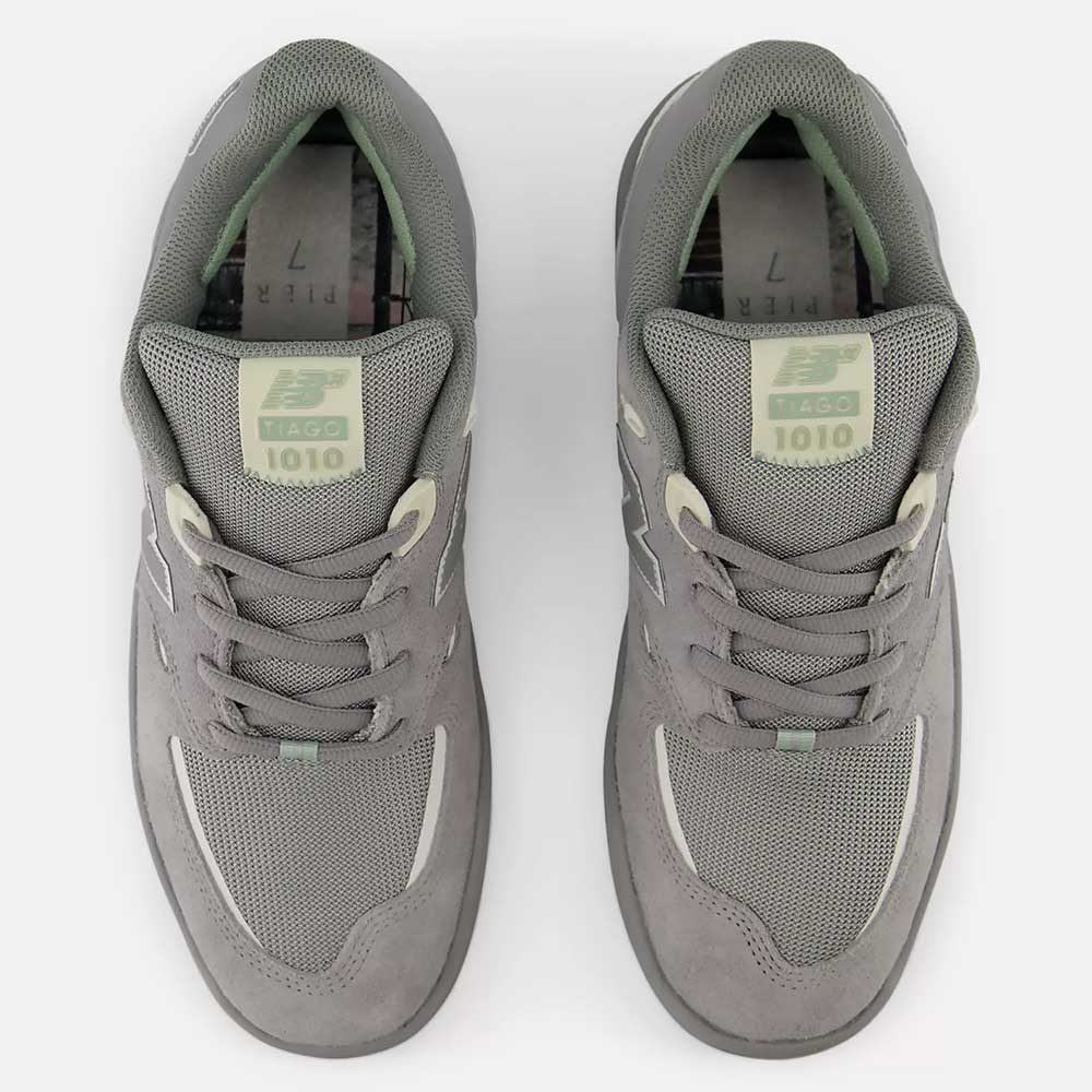 A top-down view of the 1010 PS Tiago Lemos Slate Grey Sea Salt New Balance Numeric Suede Skateboarding Shoes, featuring mesh and suede details, laced up with durable construction, ABZORB midsole, and branded tongues.