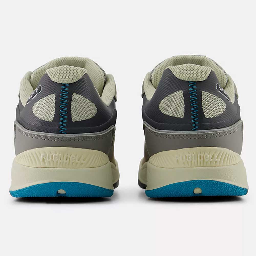 Back view of the 1010 Y Tiago Lemos Gray Day Marble Head Island Blue New Balance Numeric suede skateboarding shoes, with gray and beige uppers, blue accents, mesh panels, detailed stitching, and textured soles.