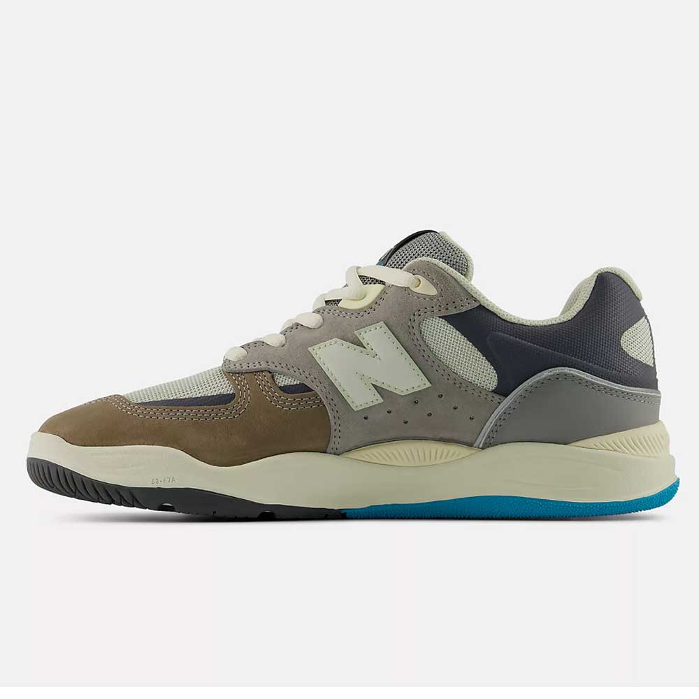 The 1010 Y Tiago Lemos Gray Day Marble Head Island Blue New Balance Numeric Suede Skateboarding Shoes feature brown, grey, cream, and navy suede and mesh panels, a cream midsole, and blue accents. Pro-endorsed skate shoe shown in side profile on white.