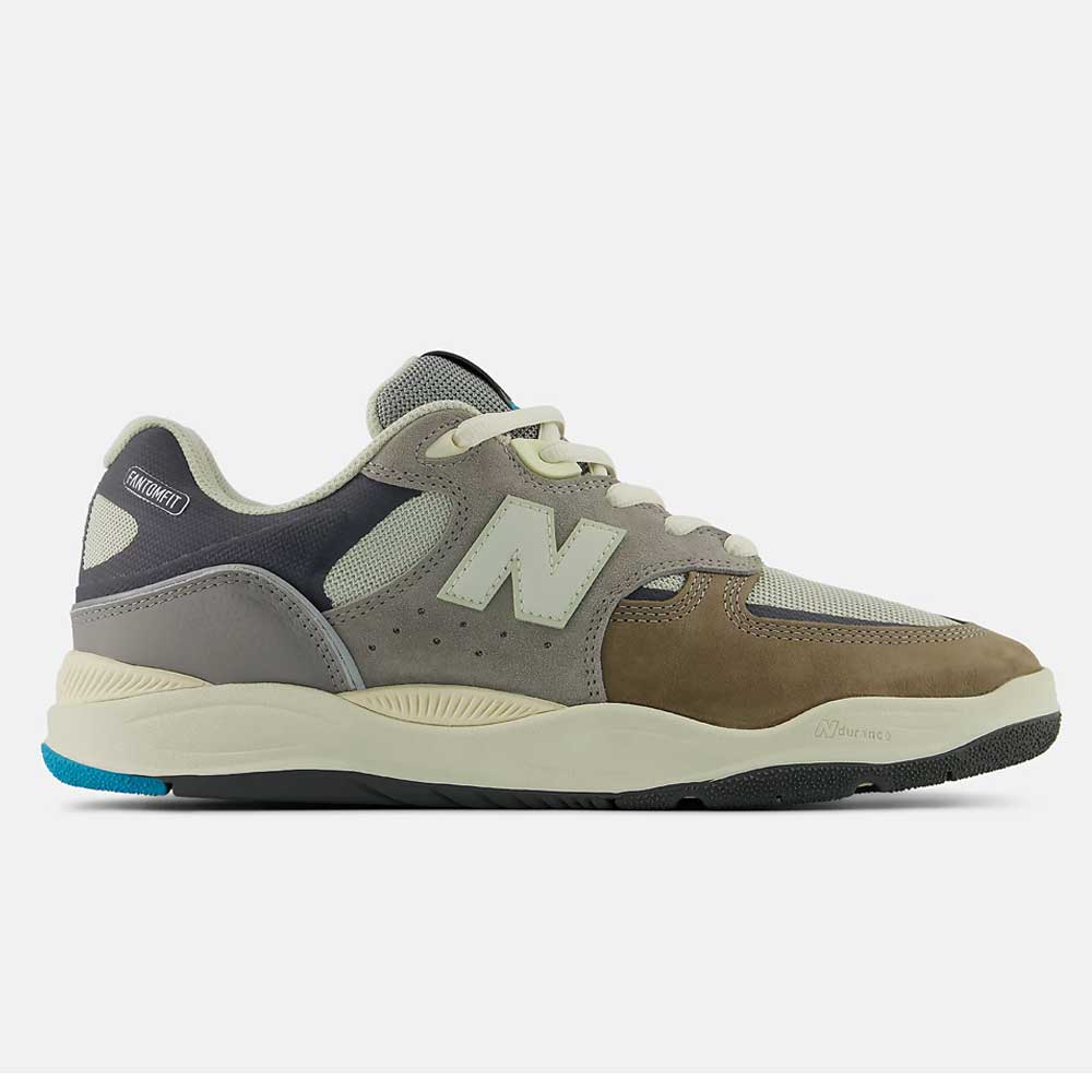 The 1010 Y Tiago Lemos Gray Day Marble Head Island Blue New Balance Numeric Suede Skateboarding Shoe features brown, grey, beige, and off-white hues with mesh and suede details, a large N logo, chunky sole with blue accents—perfect for skating.