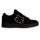 1985 Black Tan I Path Shoes Skateboarding: These black suede low-top skateboarding shoes feature a beige logo patch on the side, black laces, and a black sole with a gum rubber bottom. Perfect for anyone seeking durable and stylish suede skate shoes.
