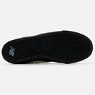 The image shows the black rubber outsole with a zigzag tread and New Balance logo of the 306 SBB Jamie Foy Sea Salt Still Water New Balance Numeric Suede Skateboarding Shoes, a vulcanized pro model.