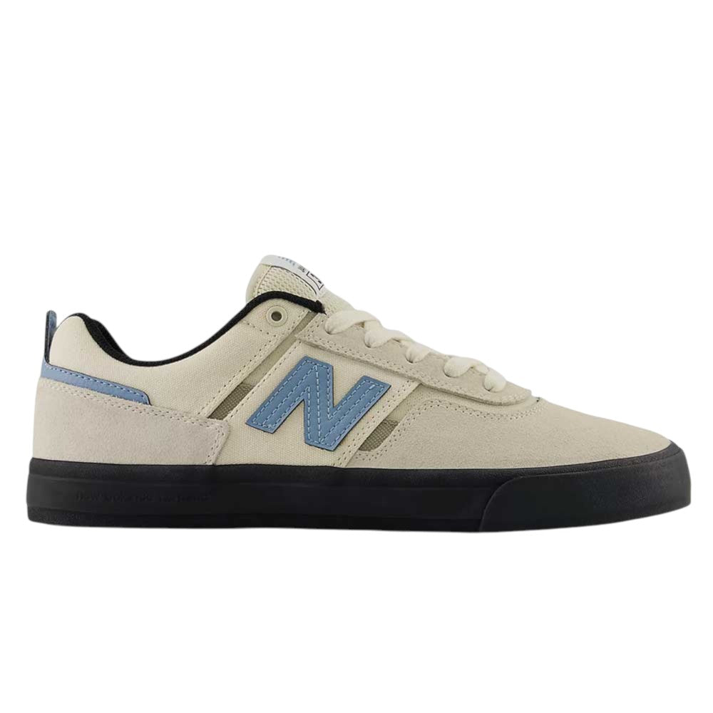 A stylish vulcanized skate shoe inspired by the Jamie Foy pro model, the 306 SBB Jamie Foy Sea Salt Still Water New Balance Numeric Suede Skateboarding Shoe features a beige suede upper with a blue N logo, black sole, and blue heel accents—shown in side profile against a white background.
