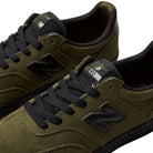 Olive green suede 340 IWT New Balance Numeric skateboarding shoes with black laces, a black N logo, a tongue tag labeled 340, and a reinforced toe cap for impact protection.
