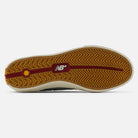 The image shows the gum sole of the 340 NBA Gray Blue Green New Balance Numeric Suede Skateboarding Shoe, featuring a zigzag tread pattern, a red line through the center, and a white New Balance logo. Designed as a vulcanized skate shoe, it offers enhanced durability and reliable impact protection for skaters.