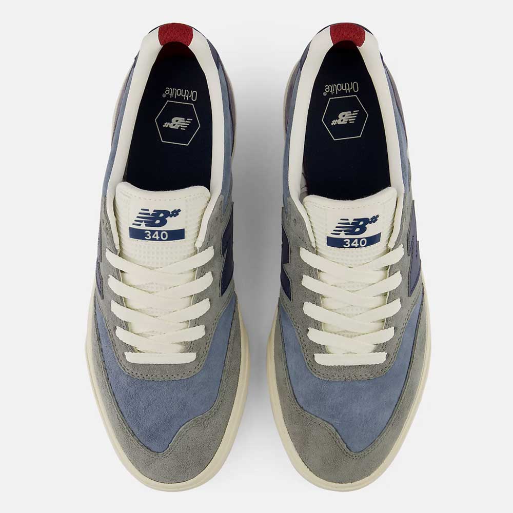 Top view of a pair of 340 NBA Gray Blue Green New Balance Numeric Suede Skateboarding Shoes in shades of grey and blue, accented with white laces and off-white soles, featuring a reinforced toe cap for added durability, displayed side by side on a plain background.