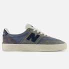 The 340 NBA Gray Blue Green New Balance Numeric Suede Skateboarding Shoes feature a grey, blue, and purple suede upper with white laces, a navy "N" logo, and a cream rubber sole with a reinforced toe cap for enhanced durability and impact protection. They are displayed in a side profile on a white background.