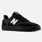 A pair of 340 YRW Black White New Balance Numeric Suede Skateboarding Shoes, featuring a sleek black suede upper with a white “N” logo on the side, black laces, a white heel patch, and a thick black sole with a reinforced toe cap for enhanced durability and impact protection, displayed against a light gray background.