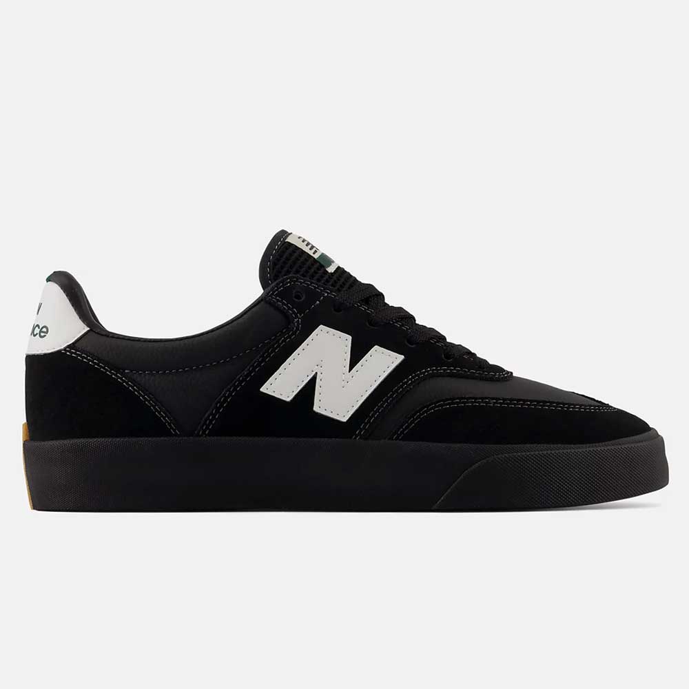 The 340 YRW Black White New Balance Numeric Suede Skateboarding Shoe is shown on a plain white background, featuring a black suede upper with a white "N" logo, contrasting white heel detail, and black sole. This vulcanized skate shoe is equipped with a reinforced toe cap for enhanced durability and impact protection in every session.