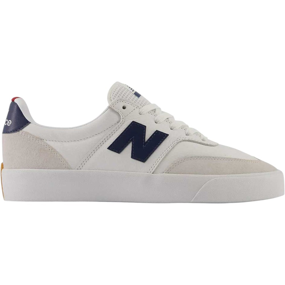 The 340 YRW New Balance Numeric Suede Skateboarding Shoes are white sneakers featuring a navy blue “N” logo, white laces, suede accents, and a gum-colored detail on the heel. Designed with a reinforced toe cap for added durability, they are displayed in profile view against a plain background.