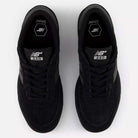A top view of the 440 BVU New Balance Numeric Suede Skateboarding Shoes showcases their black colorway, complete with black laces, black soles, and white New Balance branding on the tongue and insole—emphasizing this durable skate shoe that’s perfect for both style and performance.