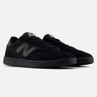 A pair of black 440 BVU New Balance Numeric Suede Skateboarding Shoes featuring durable suede uppers, black soles, and dark gray ‘N’ logos on the sides, displayed against a white background.