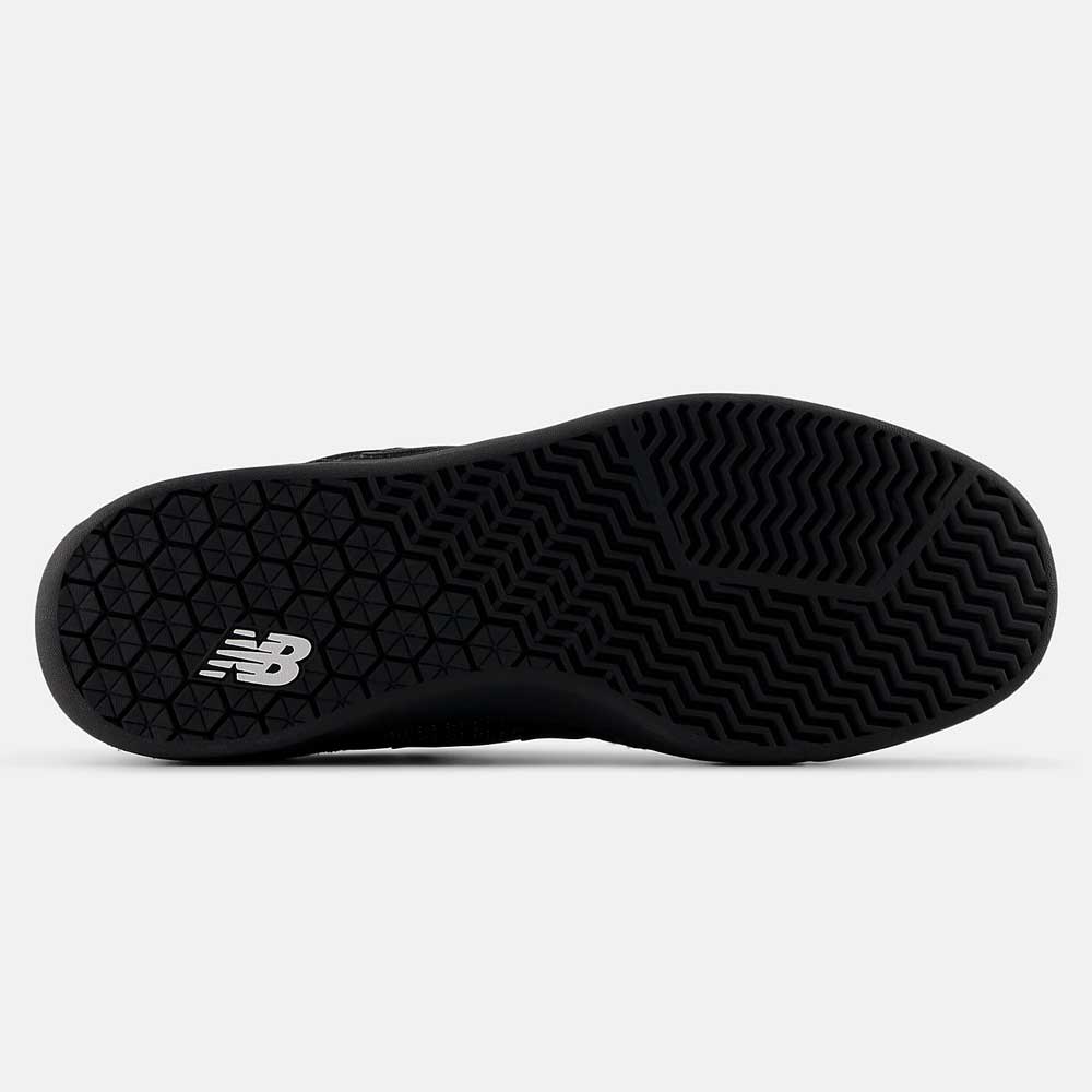 The image shows the black outsole of the 440 BVU New Balance Numeric Suede Skateboarding Shoe, featuring a white NB logo and a textured, zigzag tread pattern designed for grip.