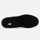 The image shows the black outsole of the 440 BVU New Balance Numeric Suede Skateboarding Shoe, featuring a white NB logo and a textured, zigzag tread pattern designed for grip.