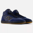 A pair of Vintage Indigo Black 440 HNN New Balance Numeric suede skateboarding shoes with black accents, durable laces, ABZORB midsole cushioning, and gum rubber soles, displayed on a plain white background.