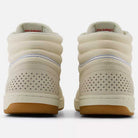 The 440 HTW Timberwolf White New Balance Numeric Suede Skateboarding Shoes are shown from the back, featuring a gum rubber sole, perforated heels, padded collars, ABZORB midsole, and visible New Balance logos on the inner heels.