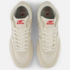 A top-down view of the Timberwolf White New Balance Numeric 440 HTW Suede Skateboarding Shoes, featuring red and white tongue labels with the New Balance logo and 440 branding, designed for durability and everyday wear.