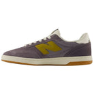 The 440 PRB Neptune Gray Seamoss New Balance Numeric Suede Skateboarding Shoe features a purple suede upper with a yellow N logo, white laces, and a light brown rubber sole. Displayed in side profile against a plain white background, it also includes a durable ABZORB midsole for enhanced comfort and support.