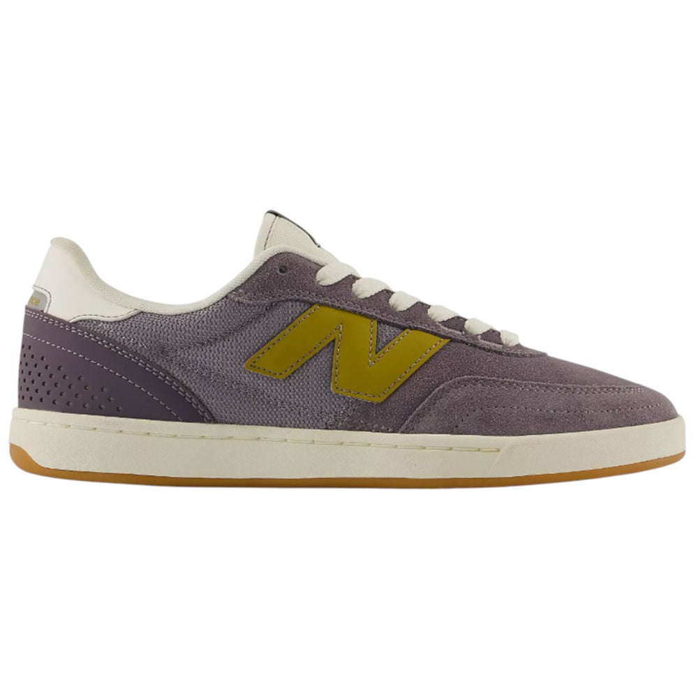 Side view of the New Balance Numeric 440 PRB Neptune Gray Seamoss Suede Skateboarding Shoe, featuring a purple suede upper with a yellow “N” logo, beige laces, and a white ABZORB midsole for enhanced comfort. The durable gum-colored outsole and beige accents on the heel and collar complete the design.