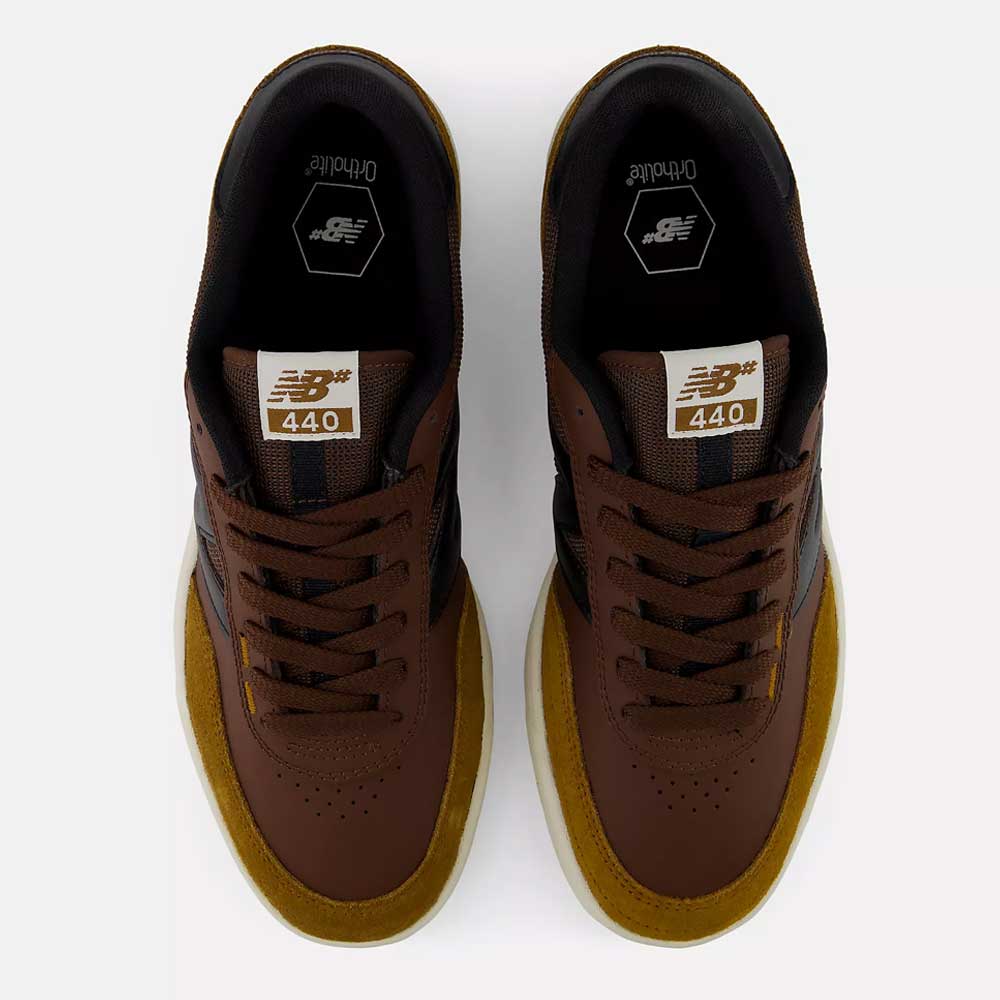 Top view of a pair of 440 PRB Pumpernickle Black New Balance Numeric Suede Skateboarding Shoes in brown with mustard yellow suede accents, black lining, and Ortholite insoles on a white background, featuring an ABZORB midsole and NDurance rubber outsole for added comfort and durability.
