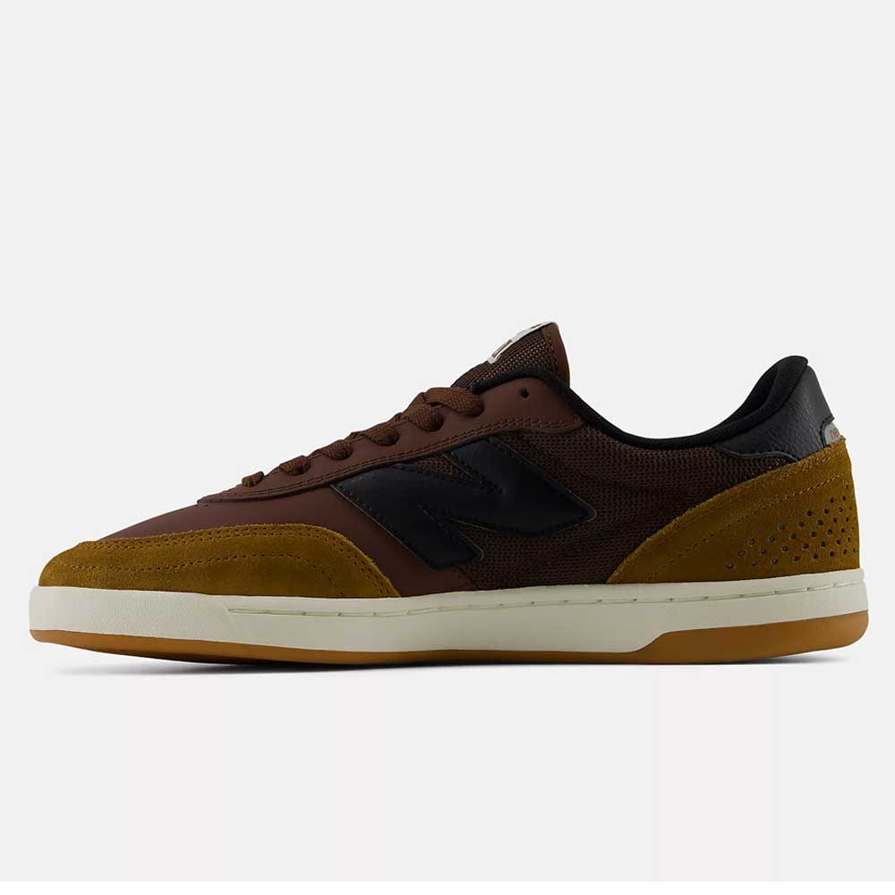 The New Balance Numeric 440 PRB Pumpernickle Black Suede Skateboarding Shoes are showcased in a side profile view on a plain background, featuring brown and mustard yellow suede uppers with black accents, a white ABZORB midsole for comfort, and a durable NDurance rubber outsole.