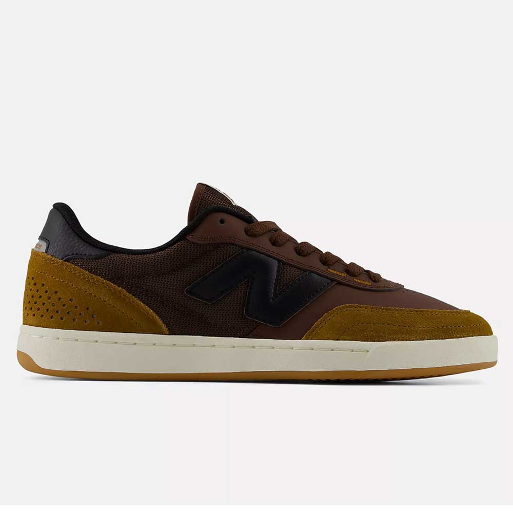 The 440 PRB Pumpernickle Black New Balance Numeric Suede Skateboarding Shoe is shown in a side profile view on a plain background, featuring brown and mustard yellow suede uppers with a black N logo, dark brown laces, perforated heel details, a white sole with ABZORB midsole cushioning, and an NDurance rubber outsole.