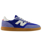 Introducing the 440 RTB Blue Gum New Balance Numeric Suede Skateboarding Shoe: This sneaker showcases a blend of blue and purple suede with crisp white laces, a white logo, striking red accents, and a classic gum sole. Displayed in a side profile against a white background, it features a durable construction and an ABZORB midsole for exceptional comfort—perfectly uniting style with high-performance skateboarding needs.