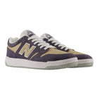 480 NAD New Balance Numeric suede skateboarding shoes in purple and tan with white laces, a light gray sole, and a design inspired by heritage basketball shoes.