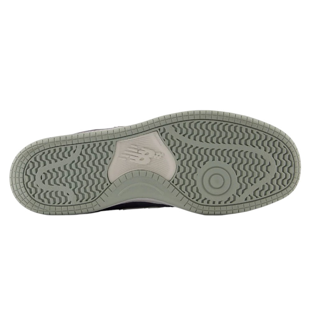 The gray rubber outsole of 480 NAD New Balance Numeric Suede Skateboarding Shoes, featuring a wavy tread pattern and a circular pivot point inspired by heritage basketball shoes.