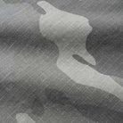 Close-up of Halfway Shorts Grey Camouflage Ripstop Cash Only COD152601, featuring baggy cotton twill fabric with a grid-like texture and irregular light and dark camo patterns.