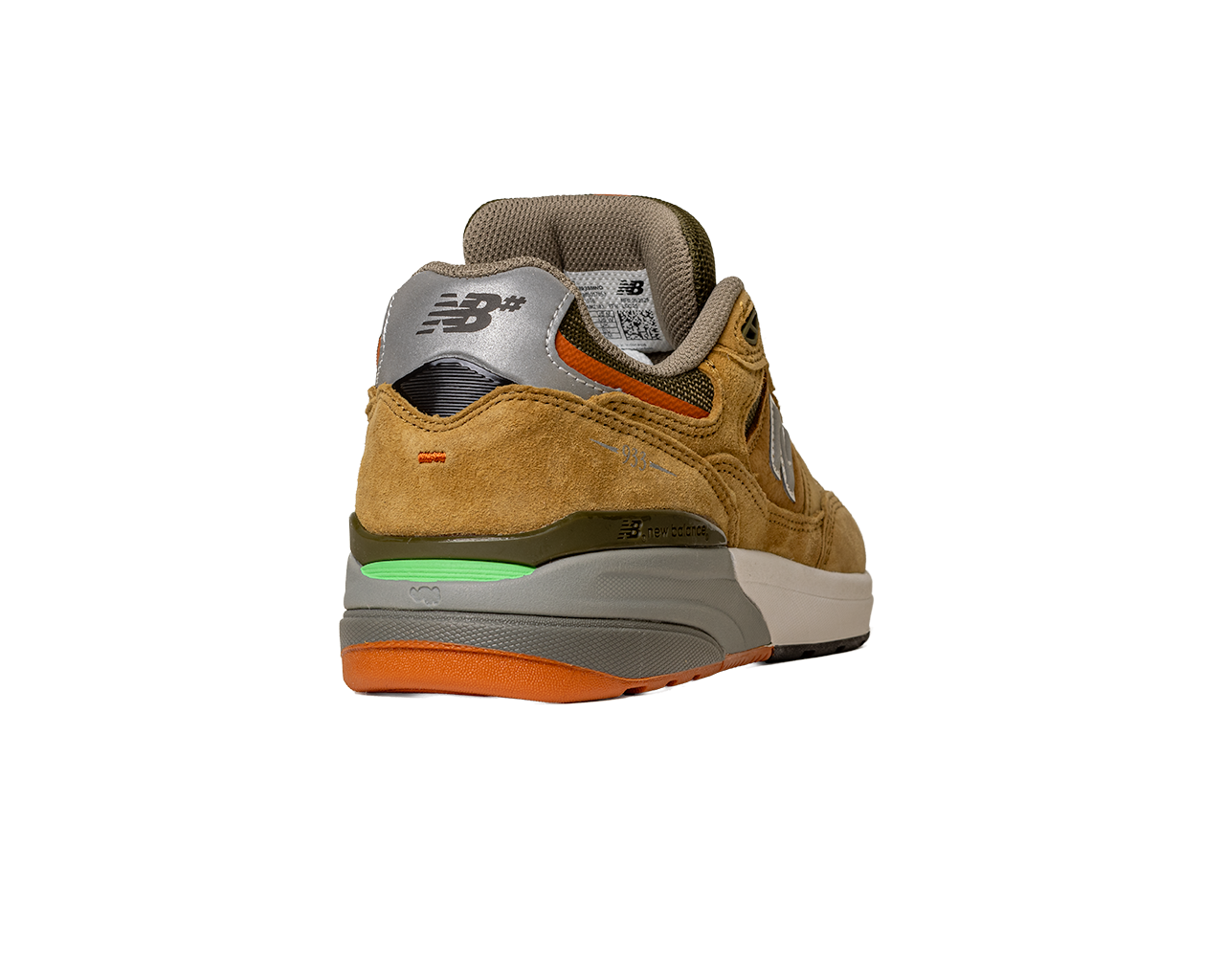 The 933 MNO Andrew Reynolds Brown Grey New Balance Numeric Suede Skateboarding Shoe is shown from the back, with a grey NB-logo heel, green and orange sole accents, beige midsole, and a tan suede upper against a white background.