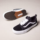 A pair of Vans Wafflecup Half Cab Black White VN000D9ZBA2 suede skate shoes—one upright, one on its side showing the signature Wafflecup™ sole—feature white laces and soles, set against a light, neutral background.