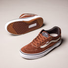 A pair of Vans Skate Kyle Walker Wafflecup Tortoise Shell VN000DA41RE1 suede rubber shoes with white soles and stripes; one shows the waffle-patterned sole, the other stands upright on a light beige background.