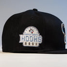 The Eagle Claw Canvas Black Corpus Christi Hooks New Era 5950 Fitted Hat features a dome-shaped embroidered Hooks patch with stars and a red accent, making it perfect for Corpus Christi Hooks fans.