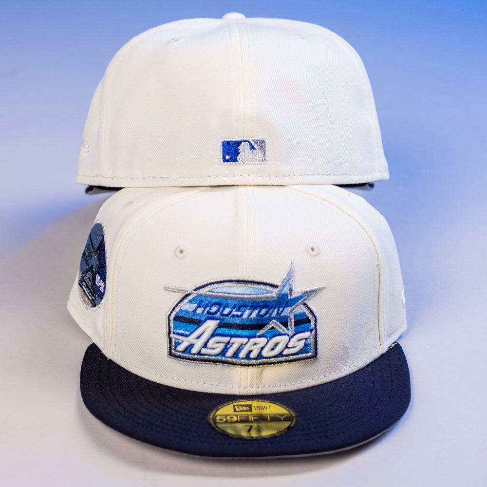 Two KB1 Rushmore 35th Chrome Navy Houston Astros New Era 5950 Fitted hats are shown—one displays the team logo on the front, the other shows the MLB logo on the back. Stickers and tags appear on the front cap.