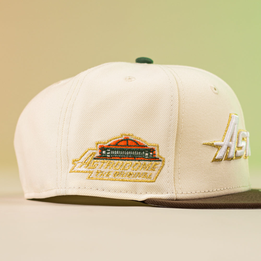 The Oompa Pink Box Houston Astros New Era Hat 5950 Fitted features a cream crown, brown brim, embroidered Astrodome patch, and side "Astros" script—ideal for fans looking to show their Houston pride.