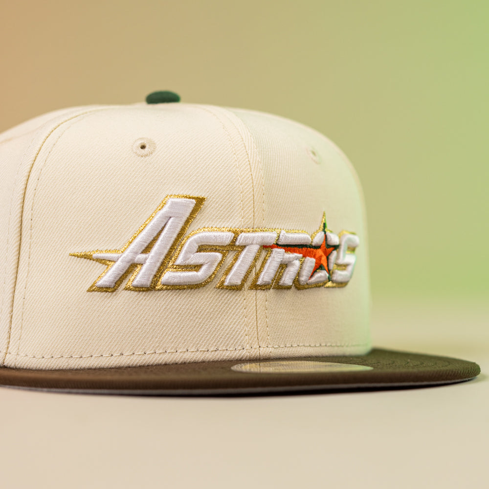 The Oompa Pink Box Houston Astros New Era Hat 5950 Fitted features "Astros" embroidered in gold and white with an orange star, a cream crown, dark green brim, and gradient yellow-green background—perfect for dedicated fans.