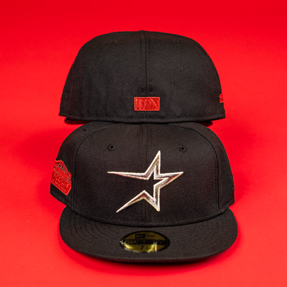 Two The Shootah Black Silver New Era Hat 5950 Fitted caps are shown on a red background—the front one displays a silver star logo and side red patch, while the rear hat reveals a small red patch on the back.