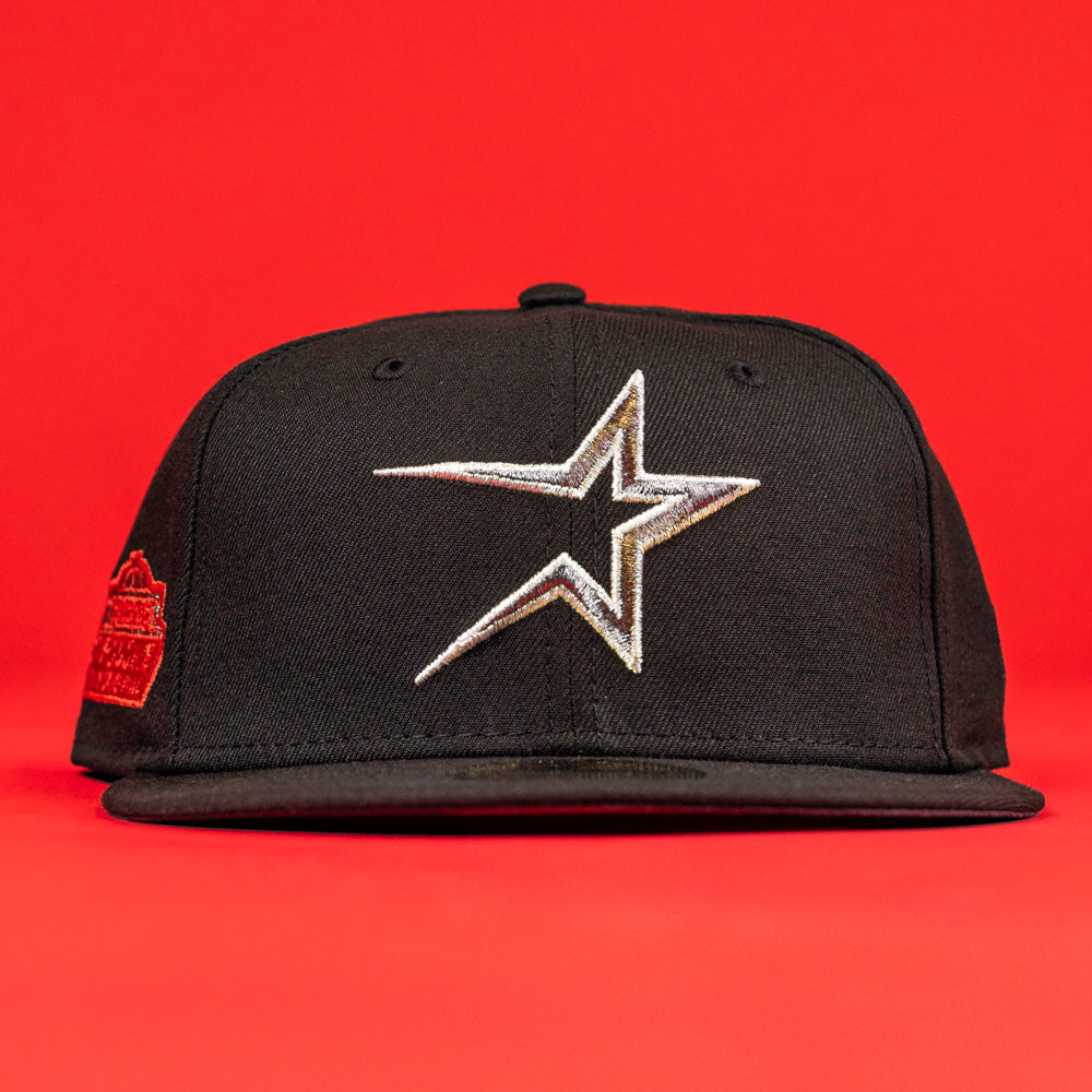 The Shootah Black Silver New Era Hat 5950 Fitted showcases a silver and white outlined star logo on the front and a small embroidered side patch, set against a vivid bright red background.